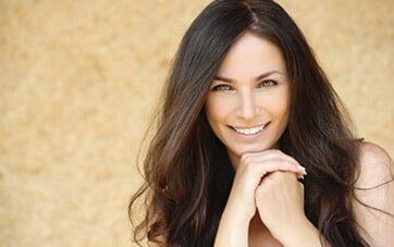 Beautiful smiling young woman — Hair styling in Altoona, PA Beautiful smiling young woman — Hair styling in Altoona, PA