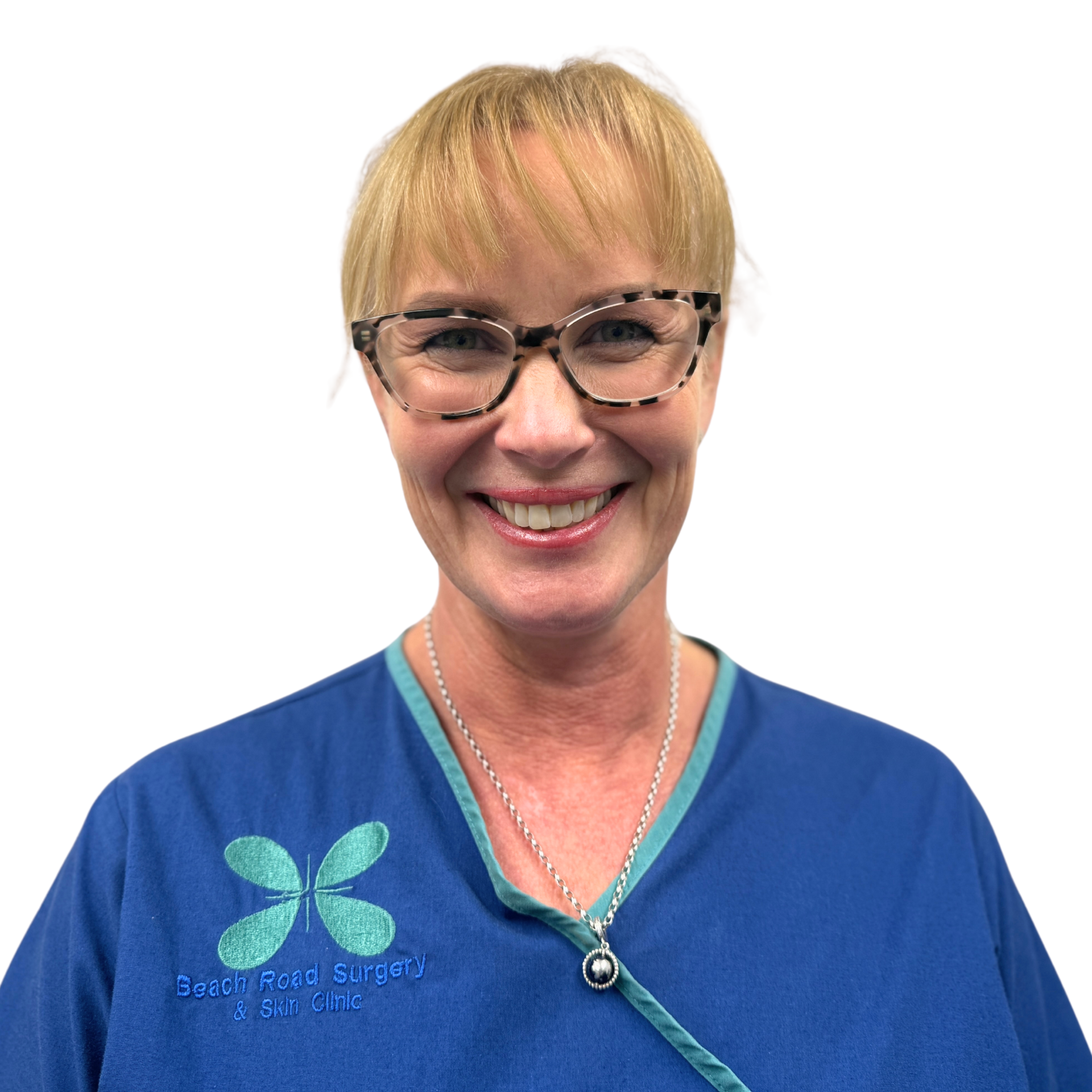 A woman wearing glasses and a blue scrub top with a butterfly on it
