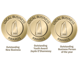 Three gold coins with the words local business awards on them