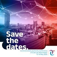 A man wearing a green hoodie is smiling for the camera.