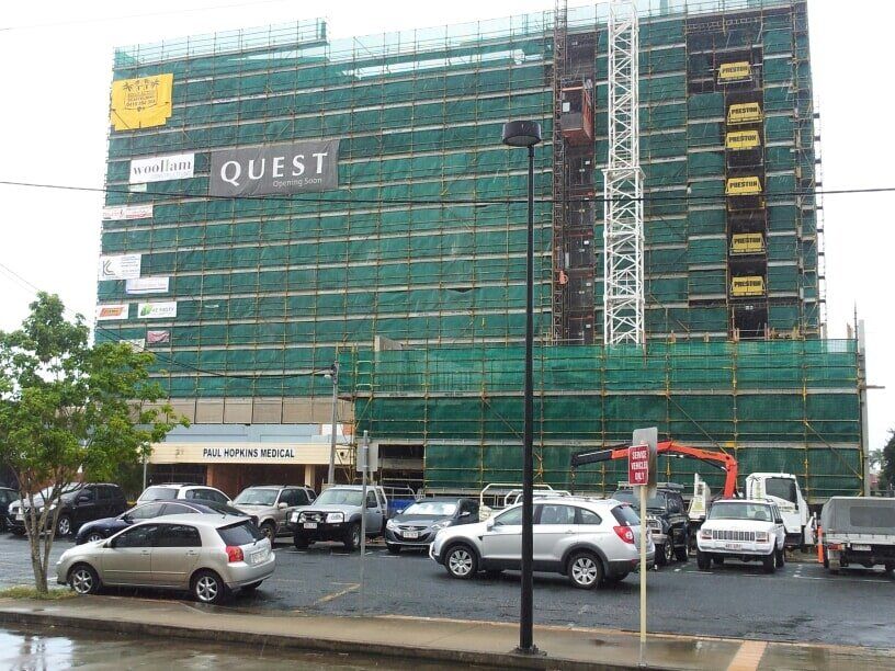 Green Fabric Covered Scaffolding — Airlie Action Scaffolding gallery in Arlie Beach, QLD