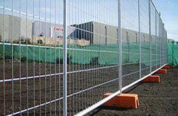 Metal Fence With Orange Foot Holds — Temp fencing Whitsundays in Arlie Beach, QLD