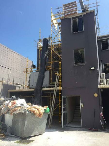 Purple Building With Scaffolding— Airlie Action Scaffolding gallery in Arlie Beach, QLD