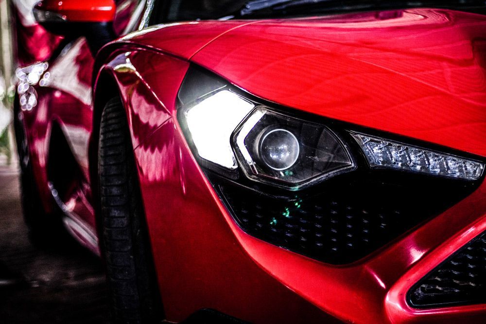 A Close Up Of A Red Sports Car 's Headlight — MJ's Mobile Car Mechanic In Dapto, NSW