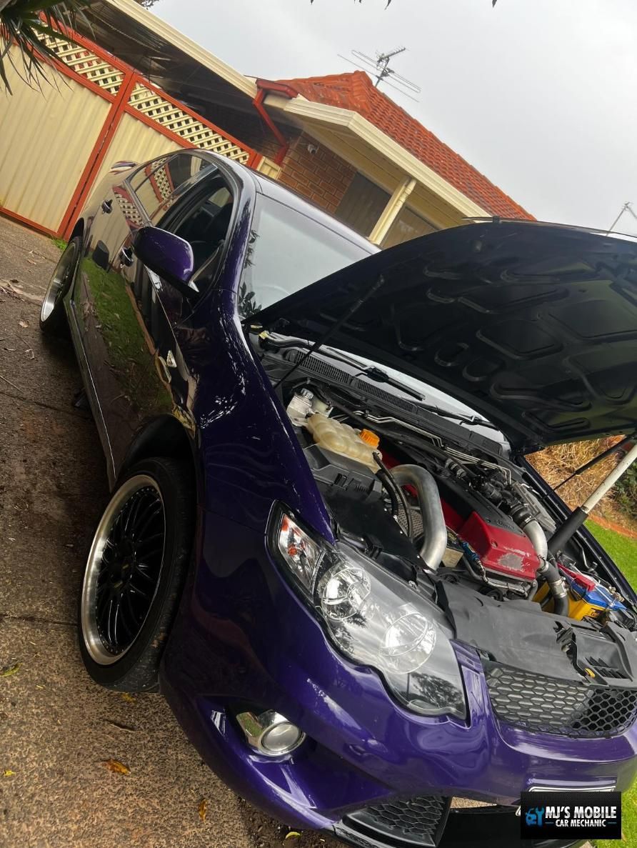 A Purple Car With The Hood Up Is Parked In Front Of A House — MJ's Mobile Car Mechanic In Camden, NSW