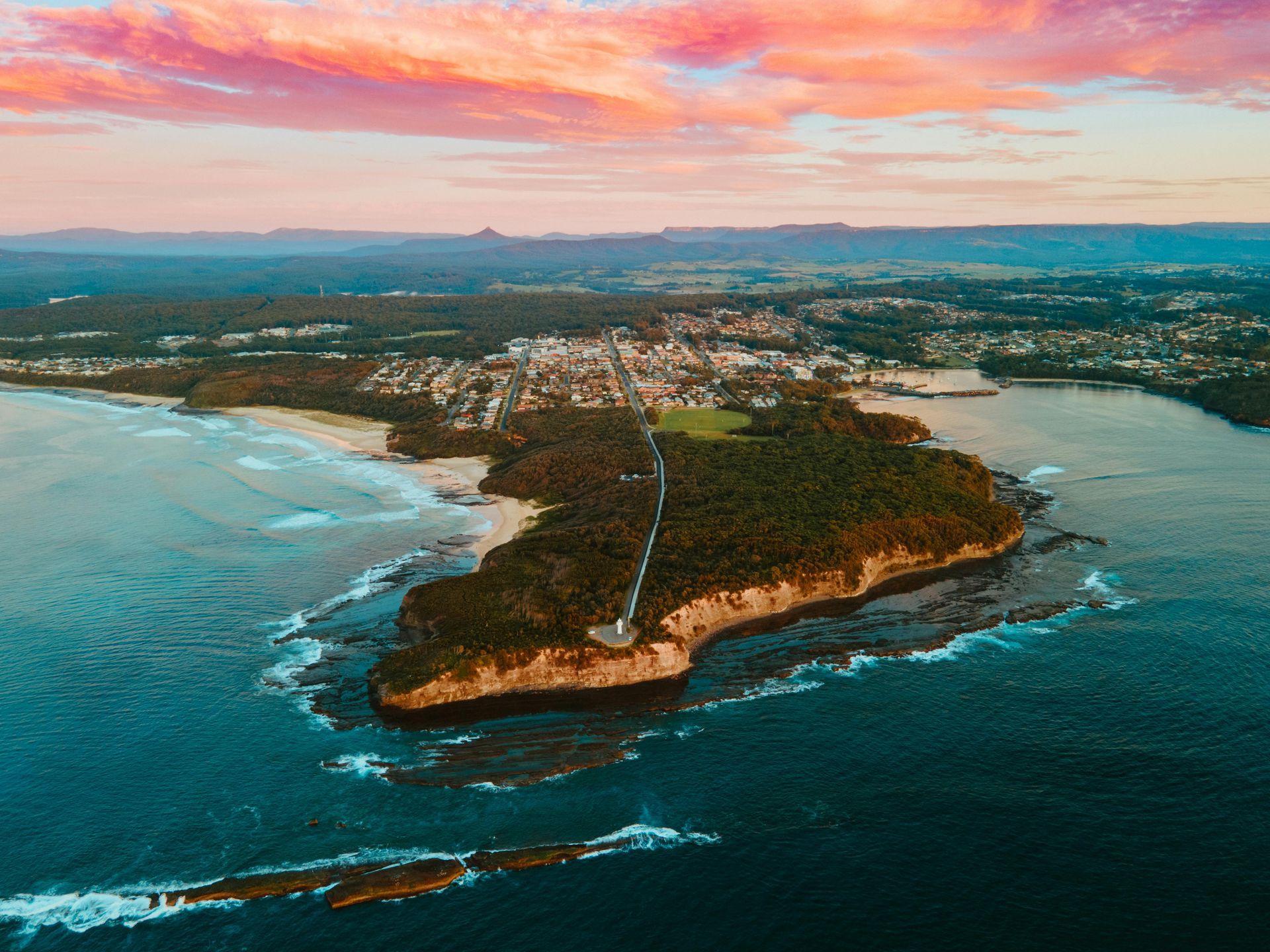 Aerial View of A Coastal Peninsula with Blue Ocean — MJ's Mobile Car Mechanic In Corrimal, NSW