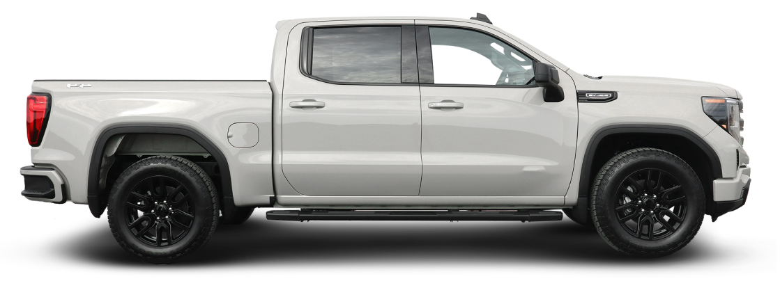 White pickup truck with large, dark gray wheels. | Spring Hill Automotive Center