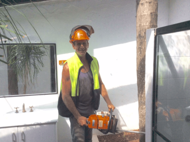 Arborist Holding a Chainsaw — Tree Services Lismore, NSW