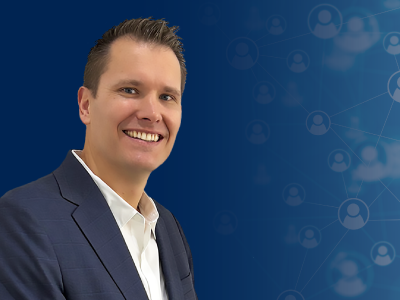 Headshot of Doug Richmond, RIX Sales Manager, in front of blue background