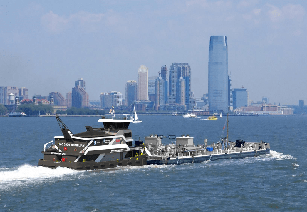 A large boat is floating on top of a body of water with a city skyline in the background.