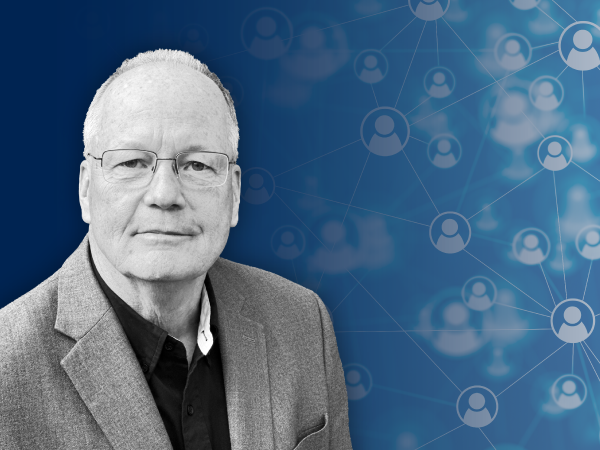 A headshot photo of Michael McNulty on Navy Blue graphic background