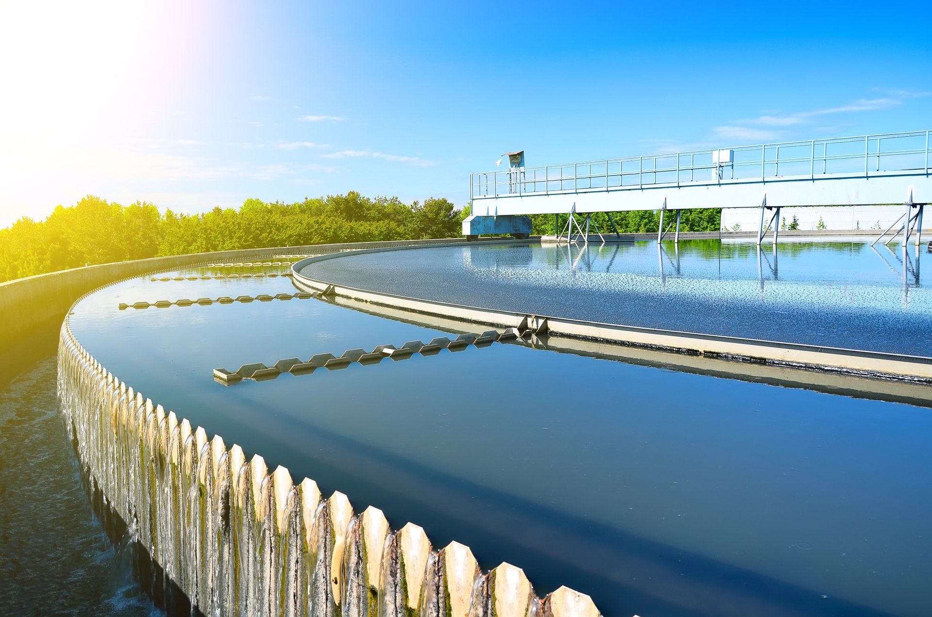 A large body of water with a wooden fence around it.