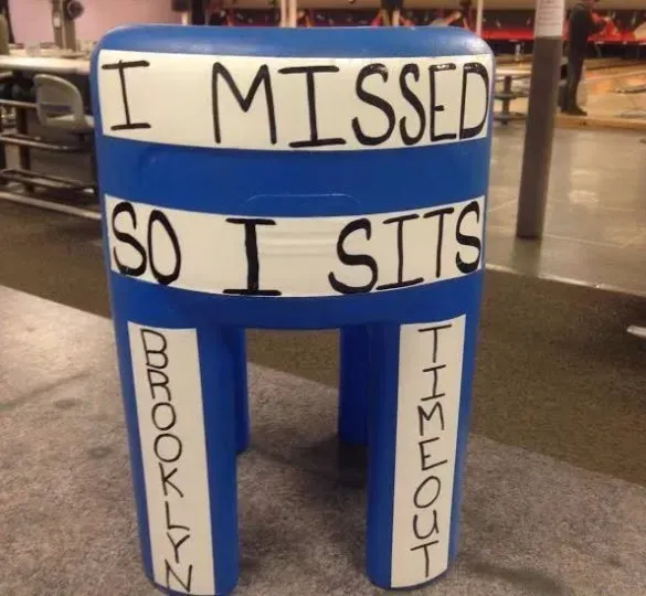 A blue stool that says i missed so i sits A blue stool that says i missed so i sits