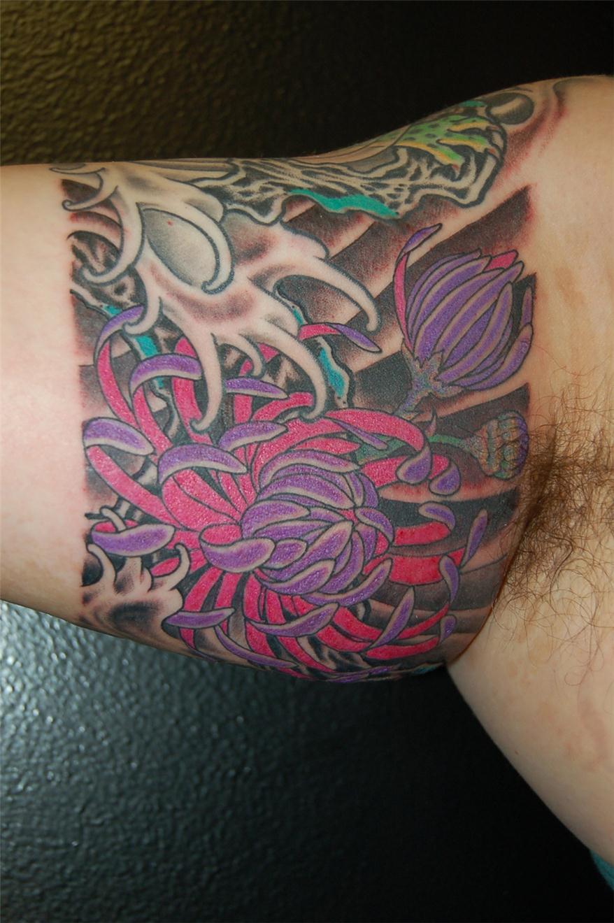 Violet and red floral tattoo — Little Rock, AR — Seventh Street Tattoos & Piercing