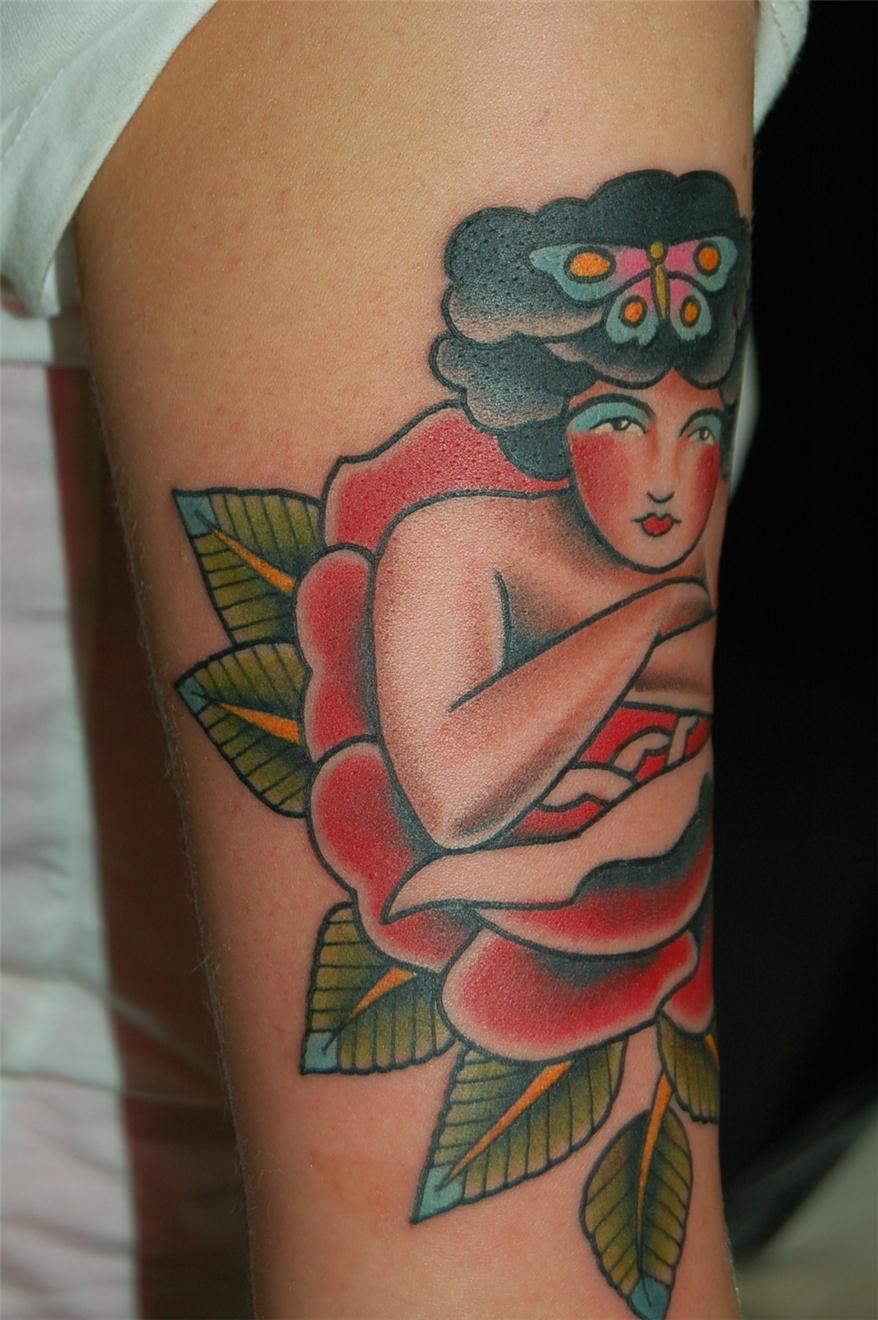 Woman on flower with butterfly on hair — Little Rock, AR — Seventh Street Tattoos & Piercing