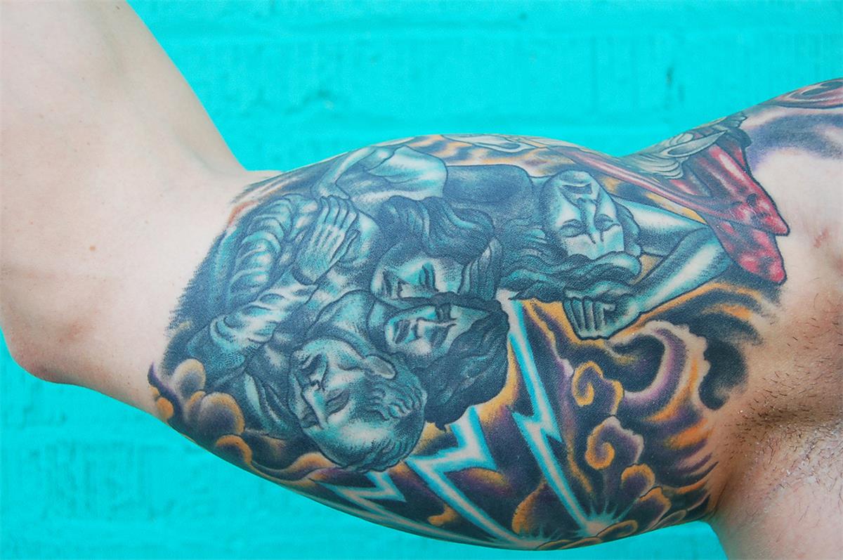 Sad family next to lightning tattoo — Little Rock, AR — Seventh Street Tattoos & Piercing