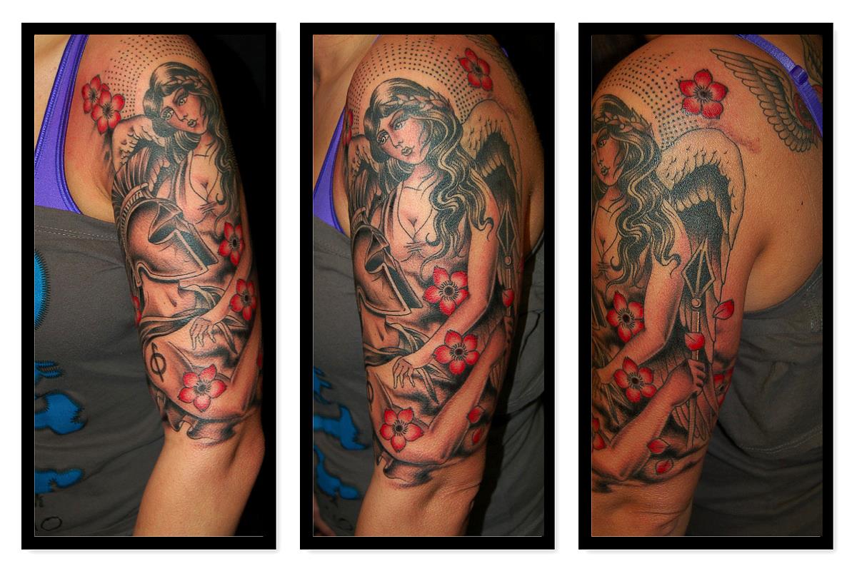 Angel holding spartan in her arms tattoo — Little Rock, AR — Seventh Street Tattoos & Piercing