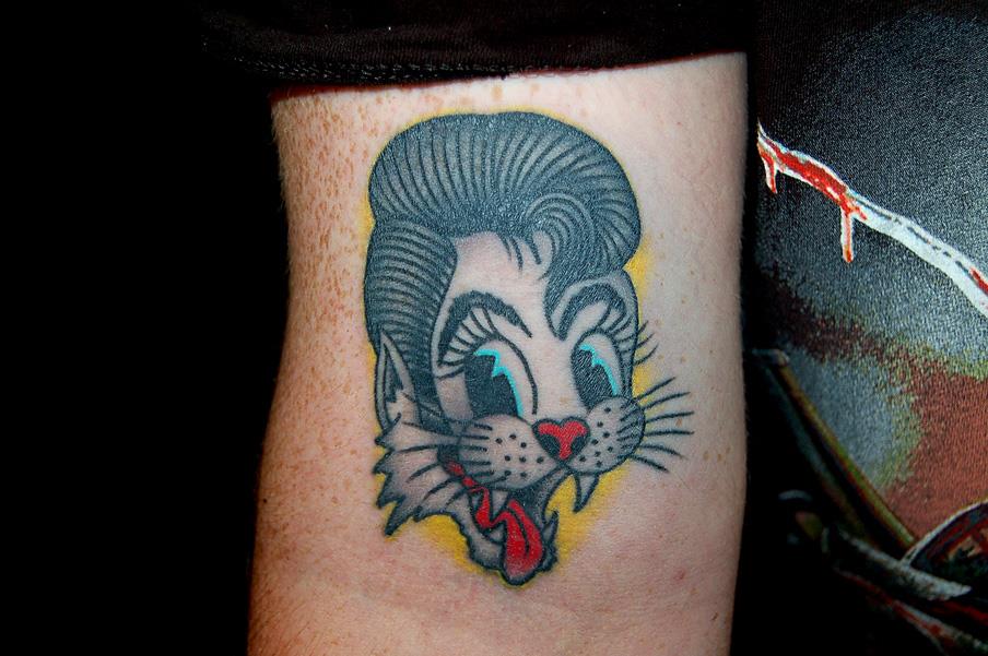Cat with elvis hair tattoo — Little Rock, AR — Seventh Street Tattoos & Piercing