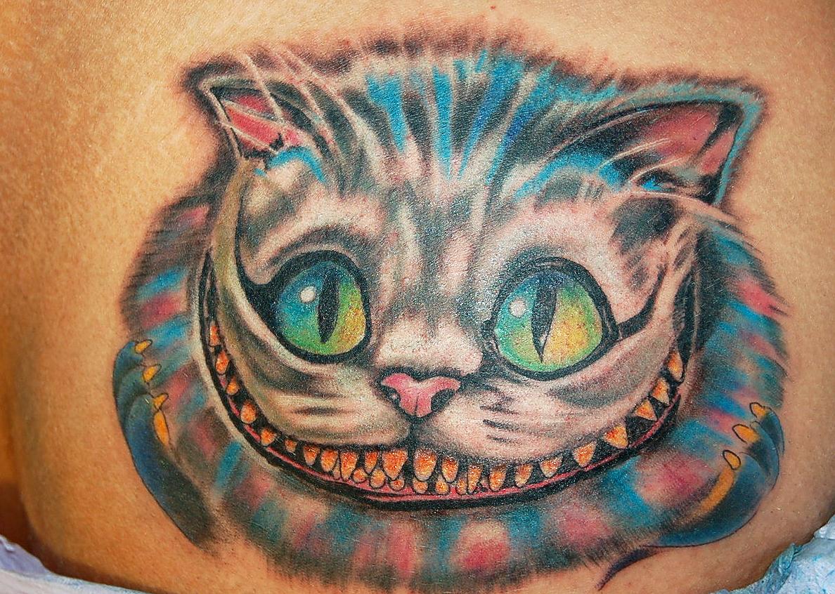 Cheshire cat tattoo — Little Rock, AR — Seventh Street Tattoos & Piercing