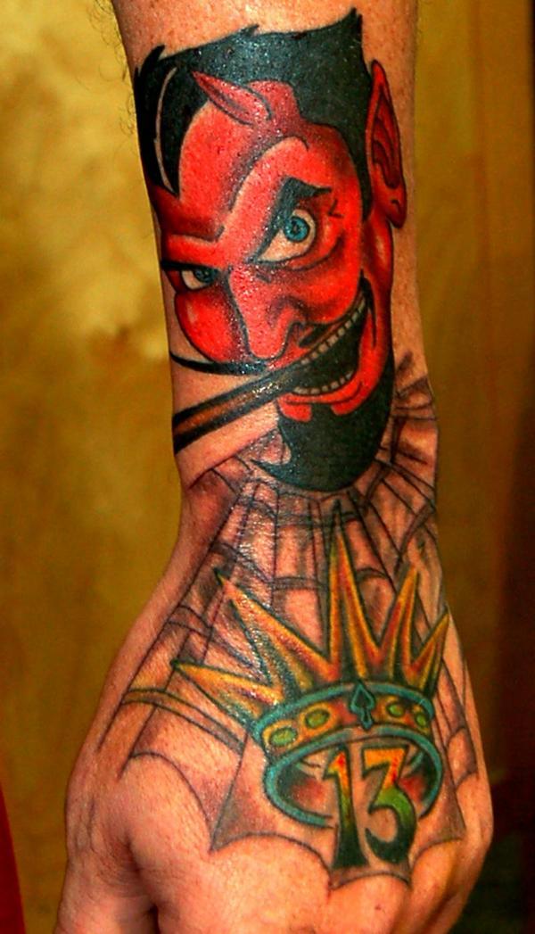 Devil beneath crown and number 13 tattoo — Little Rock, AR — Seventh Street Tattoos & Piercing