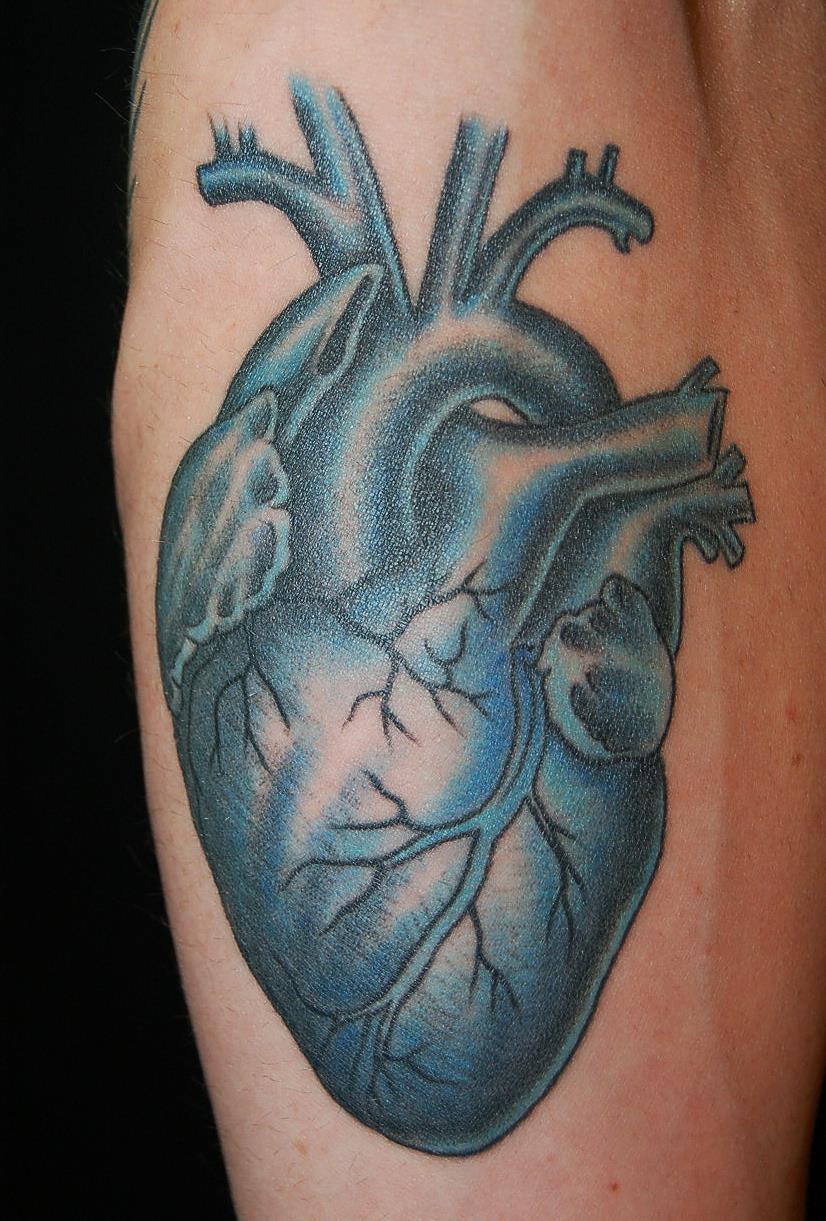 Blue ink heart tattoo — Little Rock, AR — Seventh Street Tattoos & Piercing