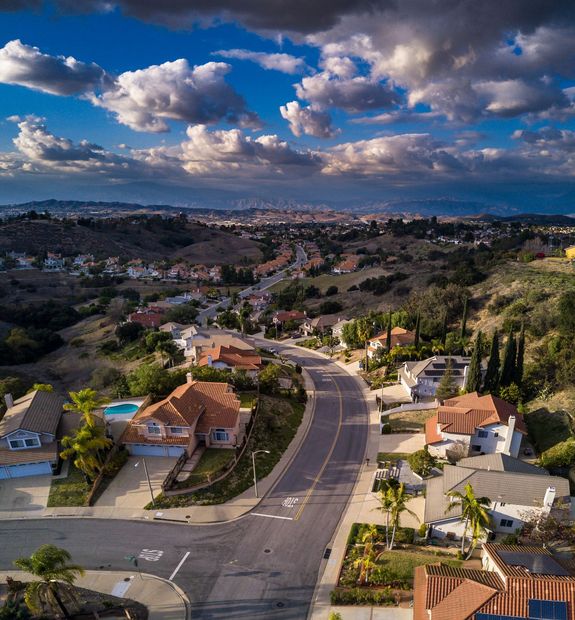 An Aerial View of a Residential Area with Houses and a Road — Moreno Valley, CA — Quen Dunn Realtor