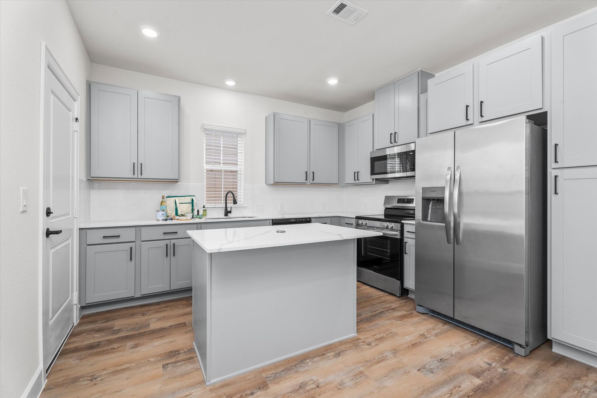 Bright kitchen with stainless appliances in Baytown TX home
