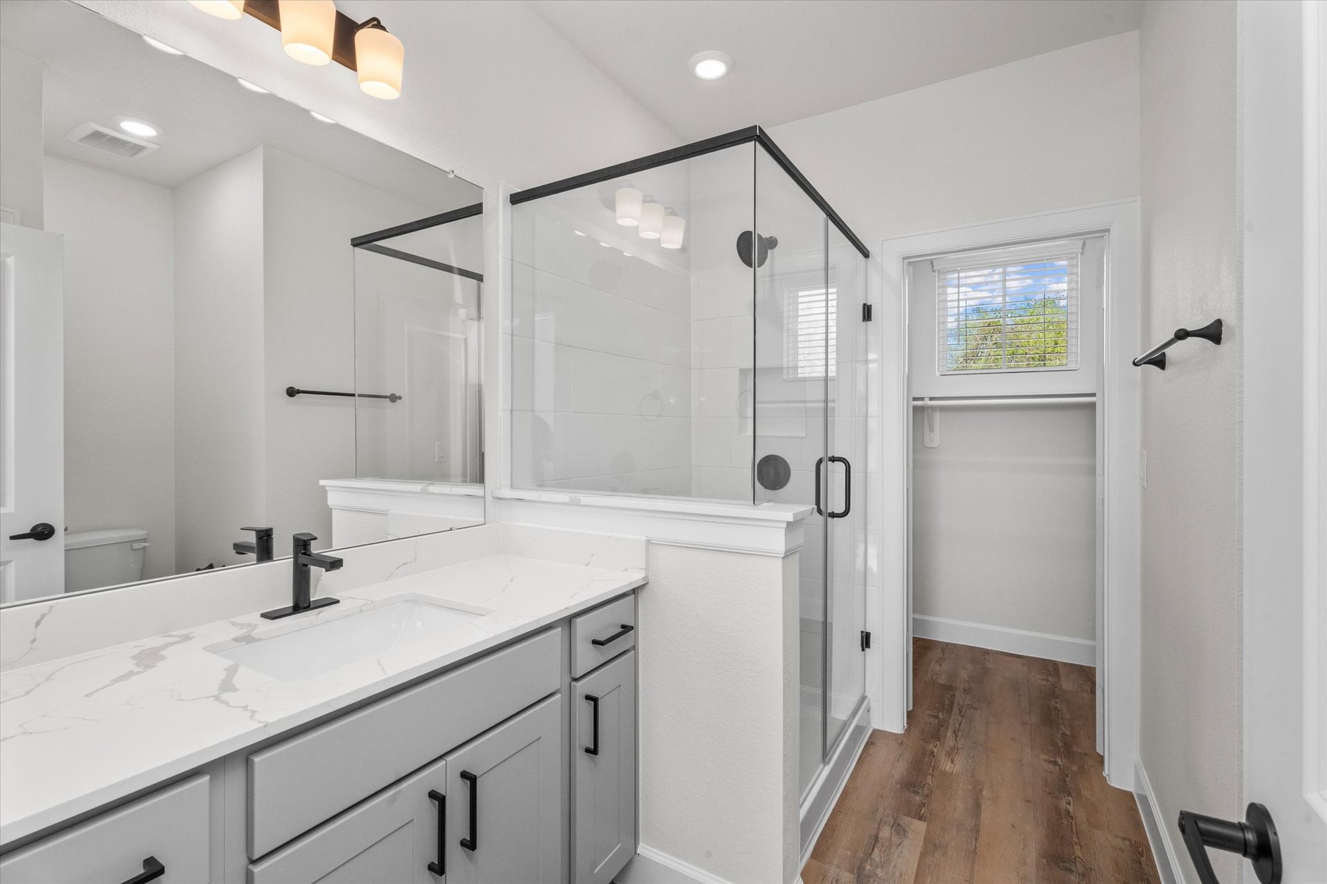 Modern bathroom with glass shower in Baytown TX home