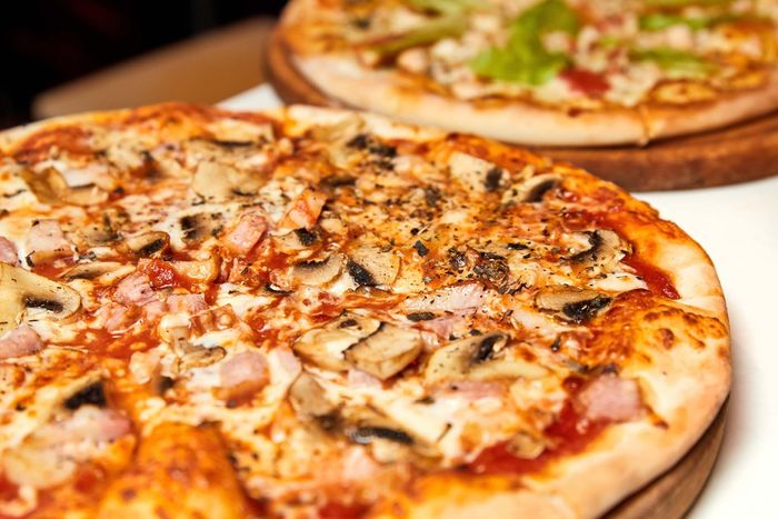 Fresh pizza with bacon, mushrooms, and cheese — Wellington, FL — Pizza Cucinova