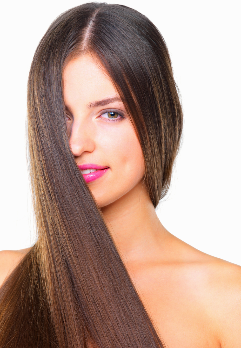 Woman with long, straight, brown hair partially covering her face, smiling with pink lips, against a white background.