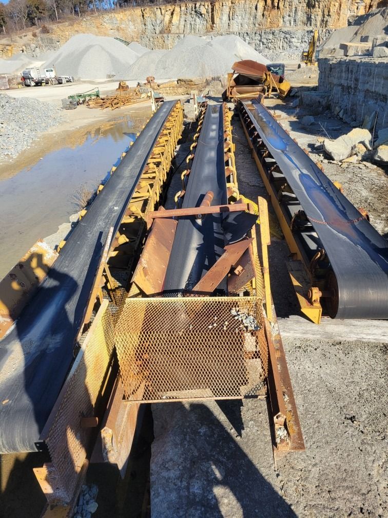 A conveyor belt is being used in a quarry
