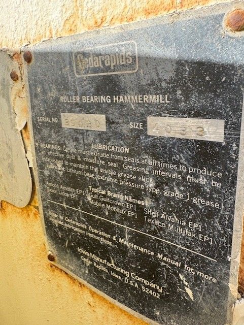 A close up of a label on a machine on a wall.