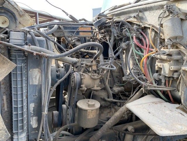 A close up of a car engine with a lot of wires