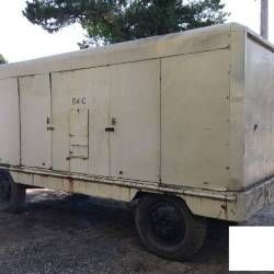 A large white truck is parked on the side of the road.