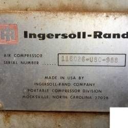 A close up of a label on a compressor made in the usa.