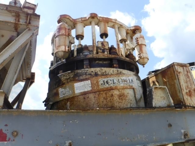 A rusty machine with the word jcl on it