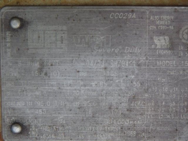 A close up of a metal plate with a lot of information on it.