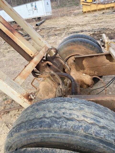 A close up of a dirty tire on a vehicle