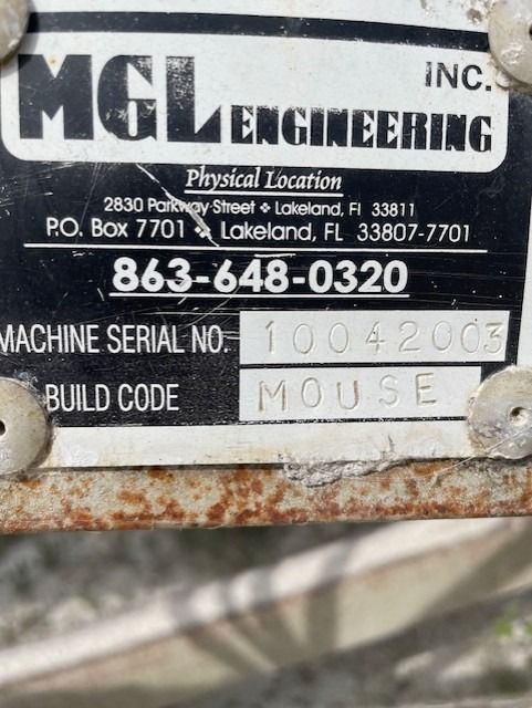 A sign that says mgl engineering on it