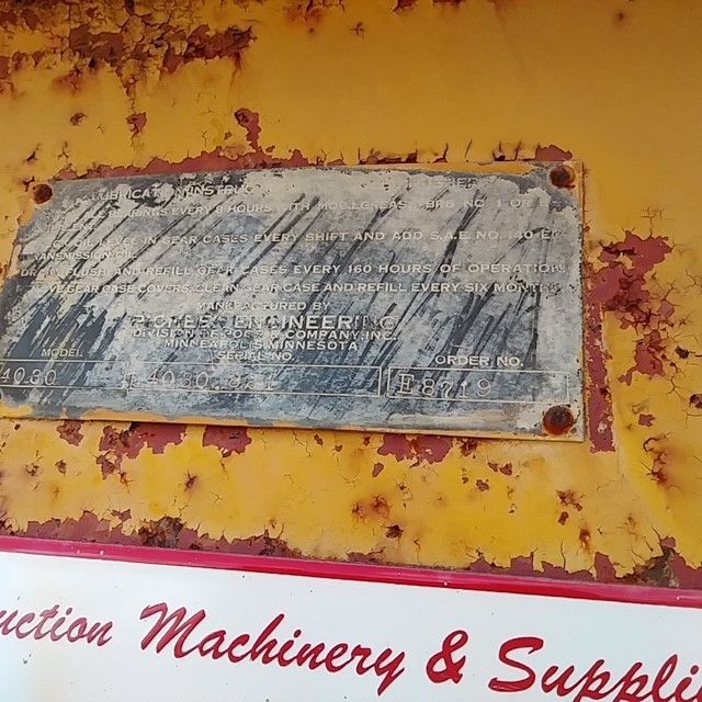 A sign that says ' machinery & supplies ' on it