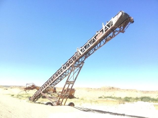 A conveyor belt with a blue sky in the background
