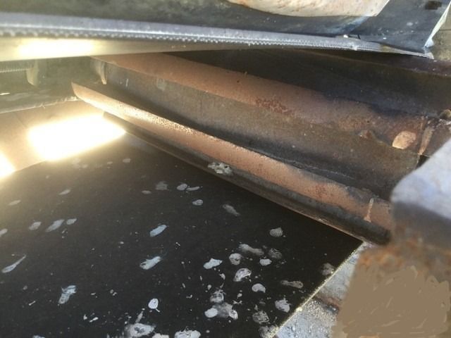 A close up of a metal object with a lot of dust on it