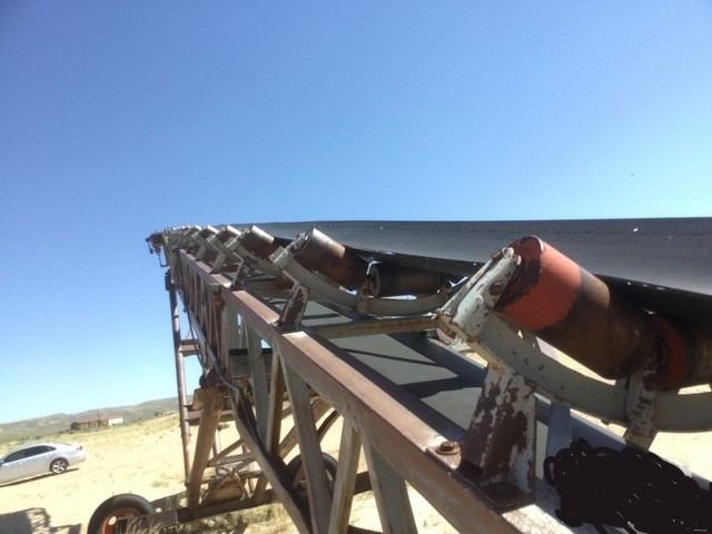A conveyor belt with a blue sky in the background