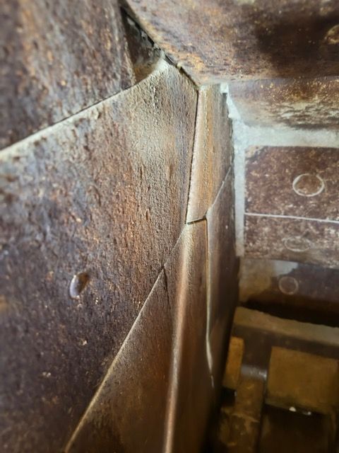 A close up of a piece of wood with a hole in it.