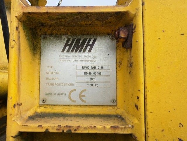 A yellow metal item with a label that says hmh on it