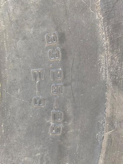 A close up of a tire with the numbers written on it.