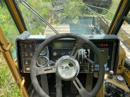 A close up of a steering wheel on a tractor.