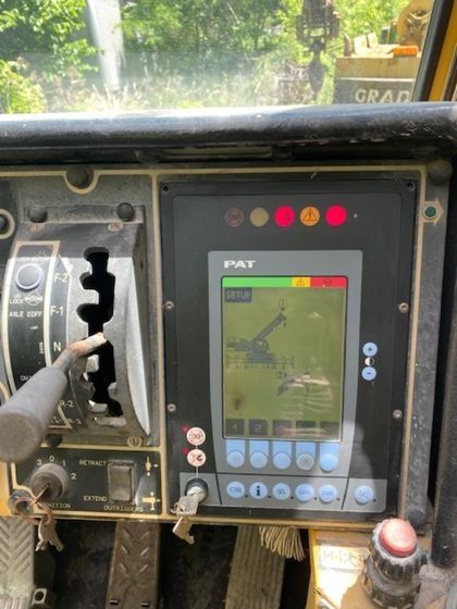 A dashboard of a tractor with a monitor that says part on it