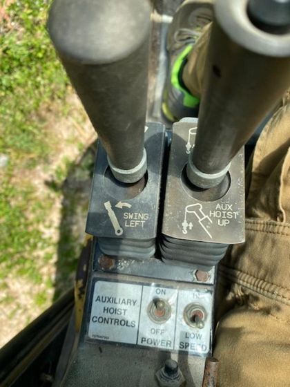 A close up of a control panel on a machine that says auxiliary most control