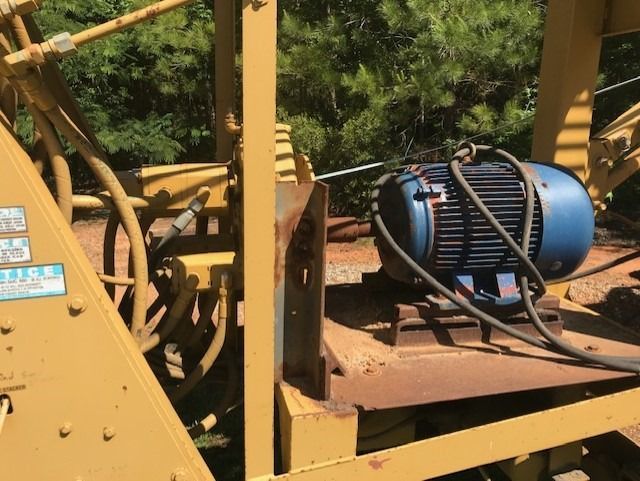 A blue motor is attached to a yellow machine